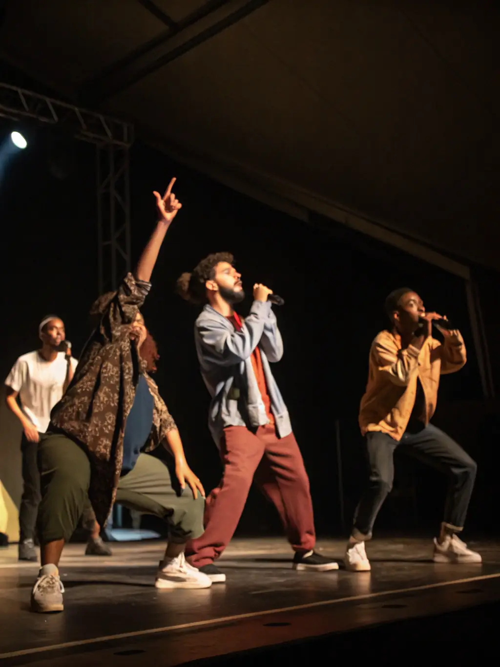 An image depicting a vibrant community performance, with participants of various ages and backgrounds engaged in a theatrical production organized by ASSOCIATION BOUT D FICELLE.
